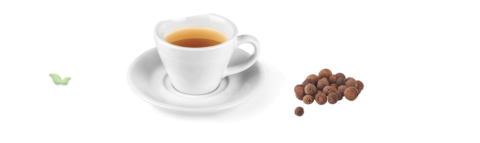 loose allspice berries beside teacup demonstrating cozy warm beverage