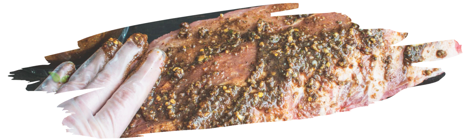 chef applying fajita seasoning as rub demonstrating cooking technique