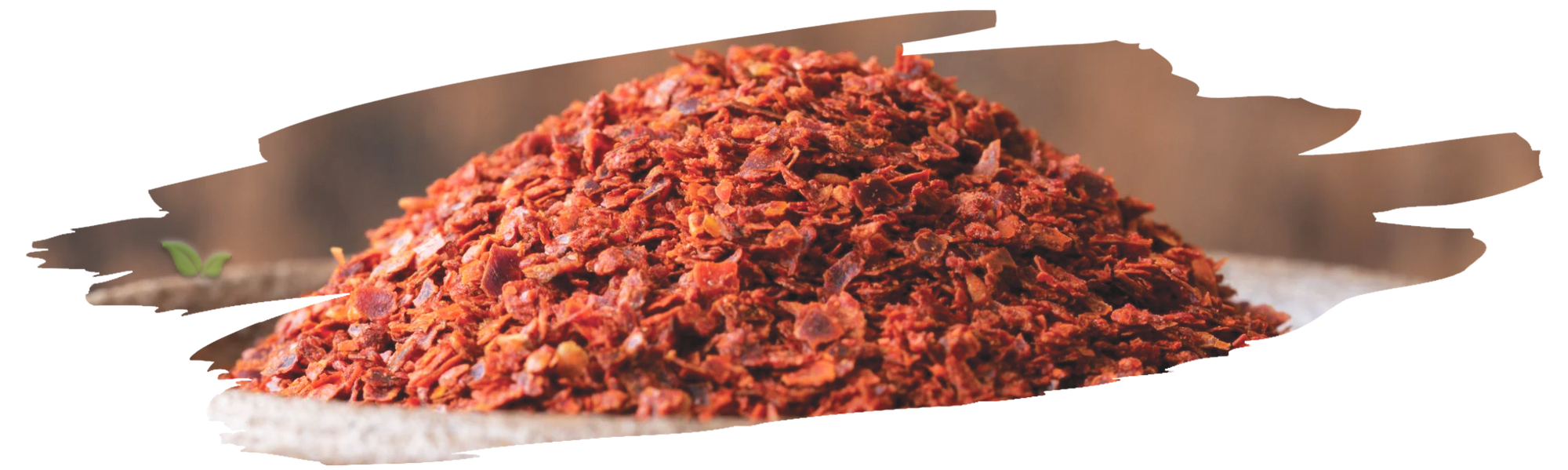 chef sprinkling aleppo pepper on dish demonstrating mild smoky heat