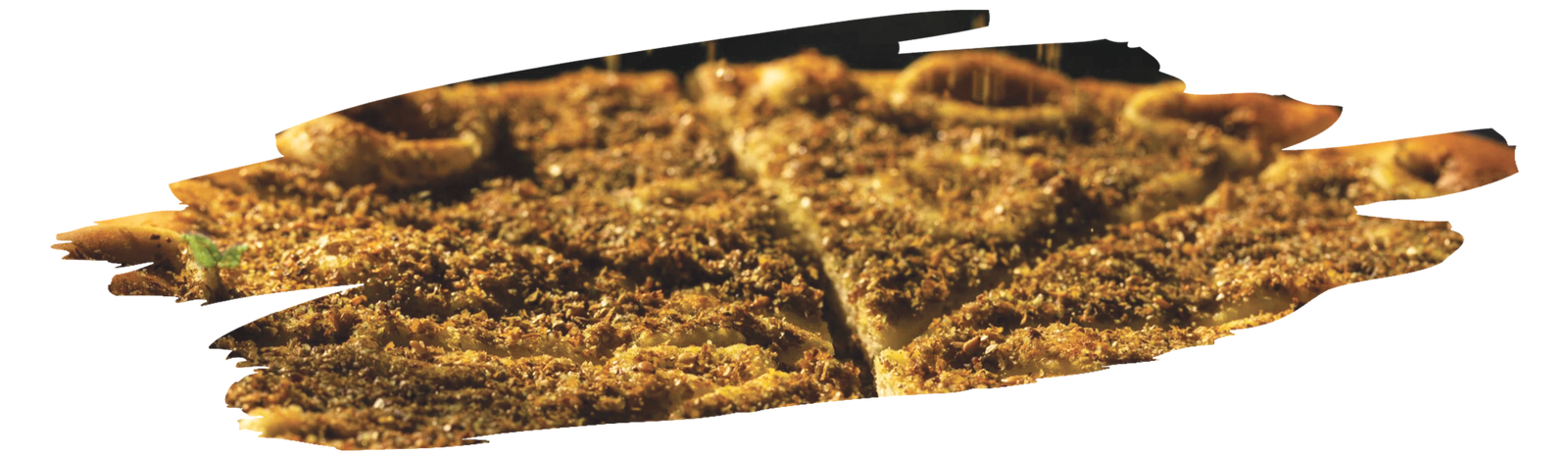 chef sprinkling zaatar on flatbread demonstrating traditional flavor use