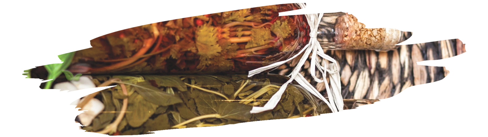 chef pouring herbs into vinegar jar demonstrating diy marinade creation