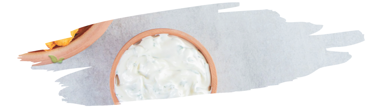 spoonful of spiced yogurt topped with chili powder representing unique savory treat