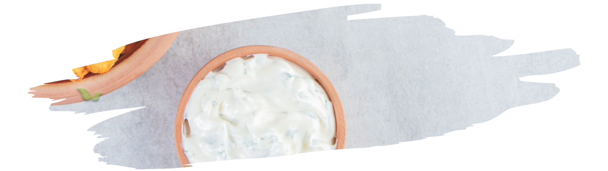 spoonful of spiced yogurt topped with chili powder representing unique savory treat