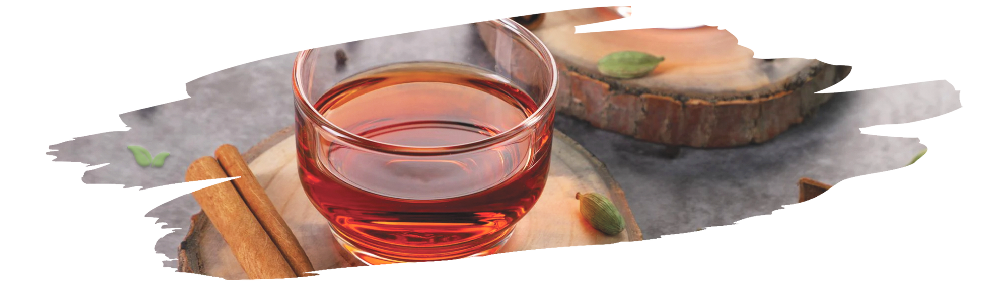Vibrant cardamom-infused black tea in a cozy teacup setting