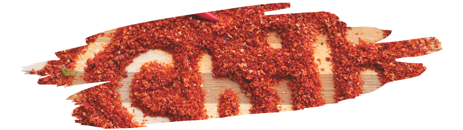 Close-up of guajillo chili showing its dark red color and smooth skin next to standard chili peppers.