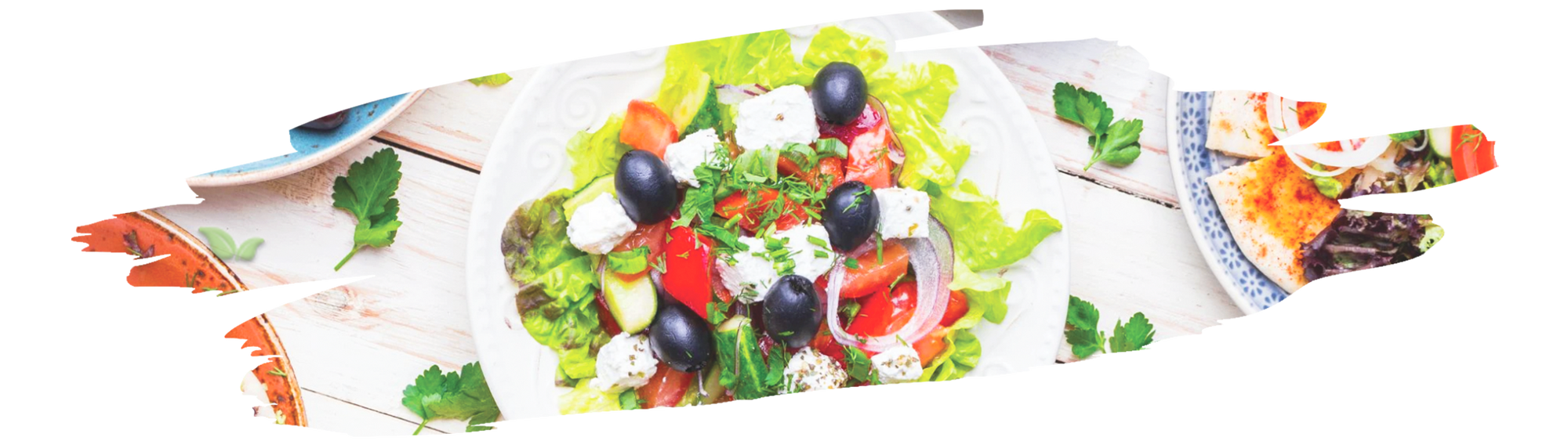 Greek seasoning sprinkled over grilled chicken and vegetables on a plate.
