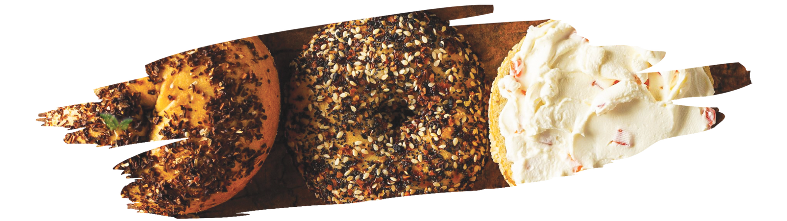 Assorted bagels with mixed seasonings including garlic flakes, onion, and sea salt toppings.