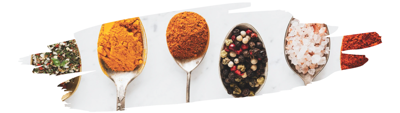 Assorted Szeged brand spices and seasonings arranged in colorful packaging for cooking