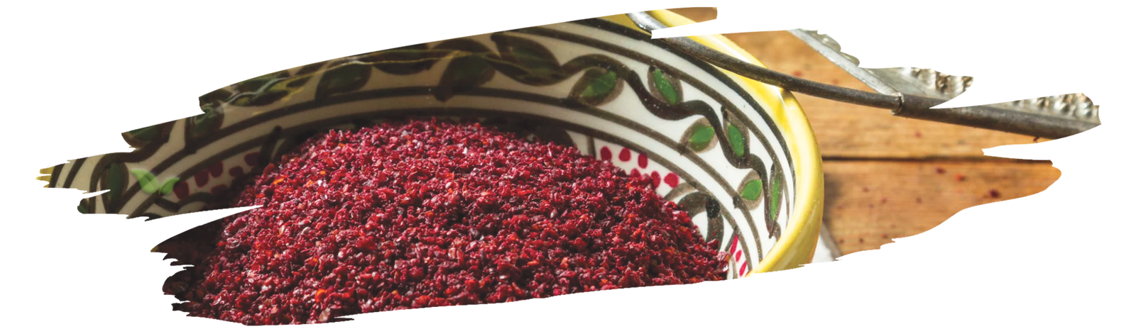 Fresh salad sprinkled with vibrant red sumac for tangy Mediterranean flavor