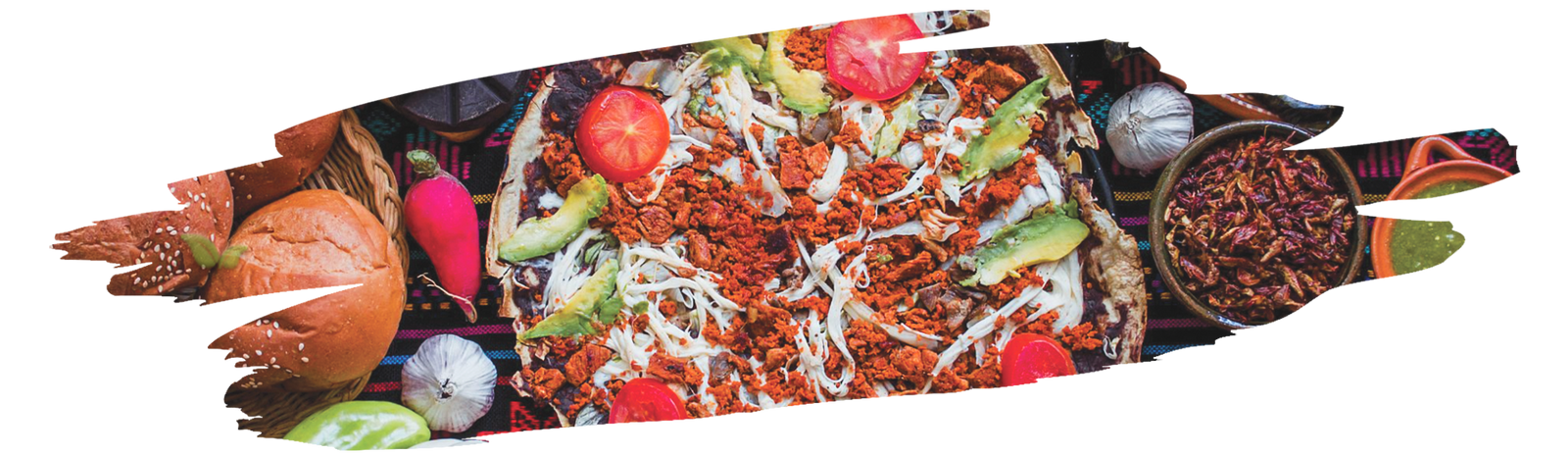 Traditional Mexican kitchen setup with colorful spices and peppers on rustic table