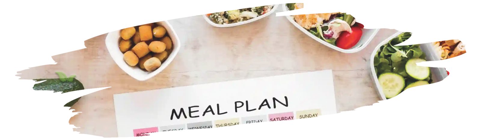 Person writing a meal plan surrounded by healthy foods and recipe ideas