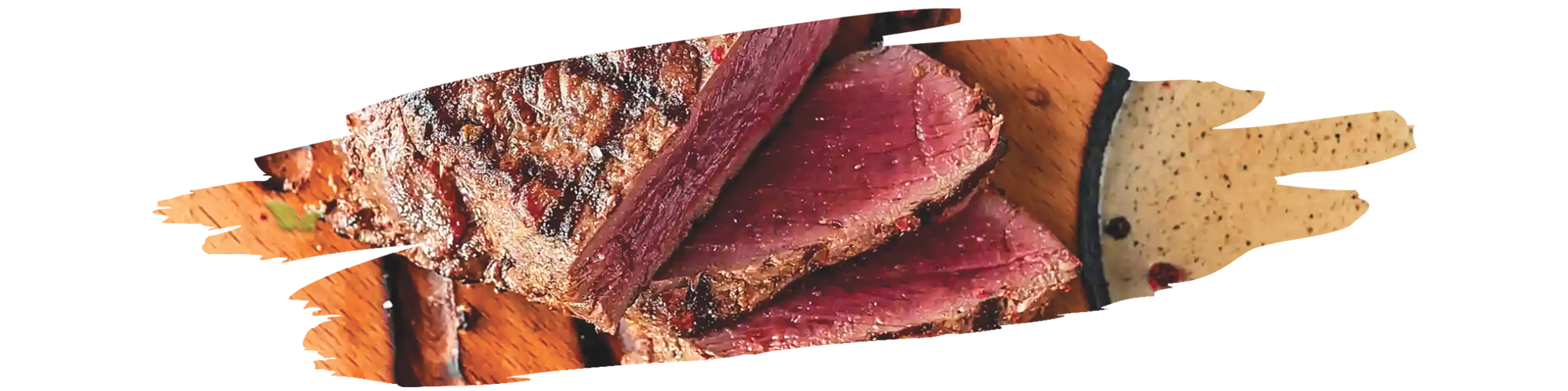 Grilled steak seasoned with American steak spice powder on wooden cutting board