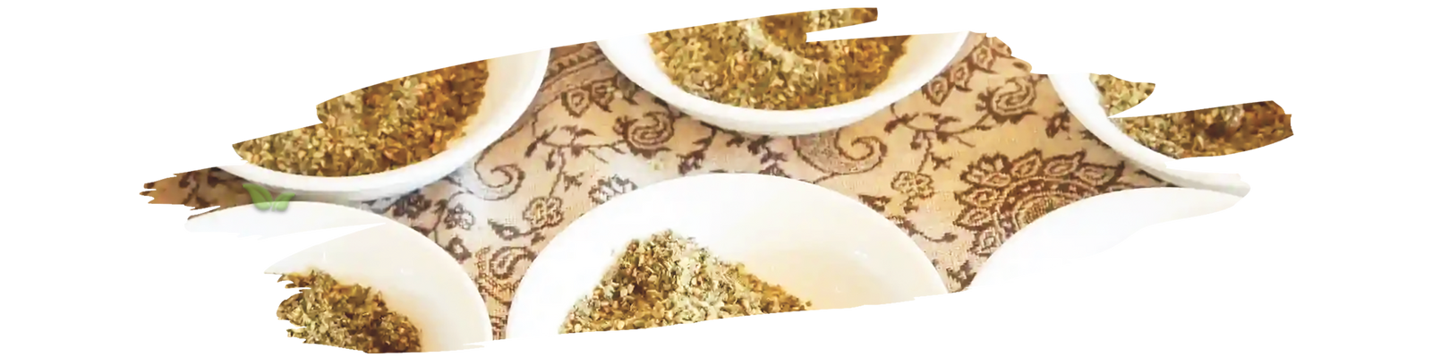 Ground allspice in wooden bowl with whole allspice berries on rustic kitchen table