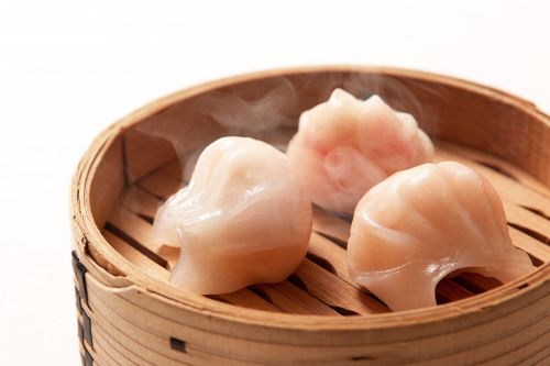steamer basket filled with assorted dim sum dumplings showing soft texture