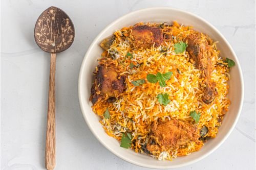 plate of chicken biryani showing layered rice and spices