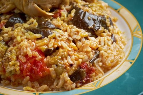 inverted maqluba rice dish showing layers of vegetables and meat