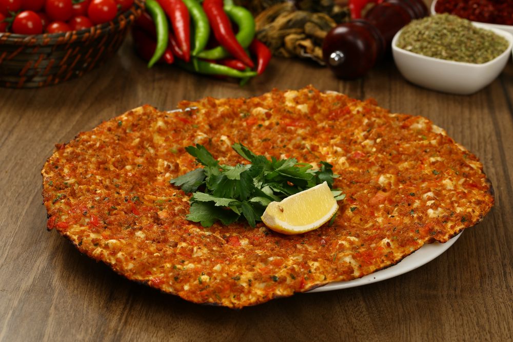 Lahmacun - Thin flatbread topped with a spicy meat mixture.