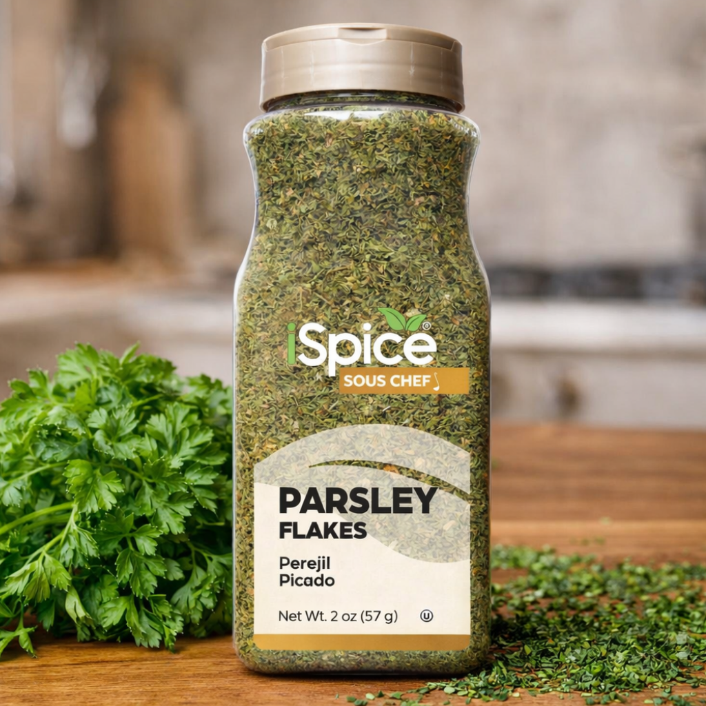 Bottle of Sous Chef Parsley Flakes on a wooden surface with parsley leaves.