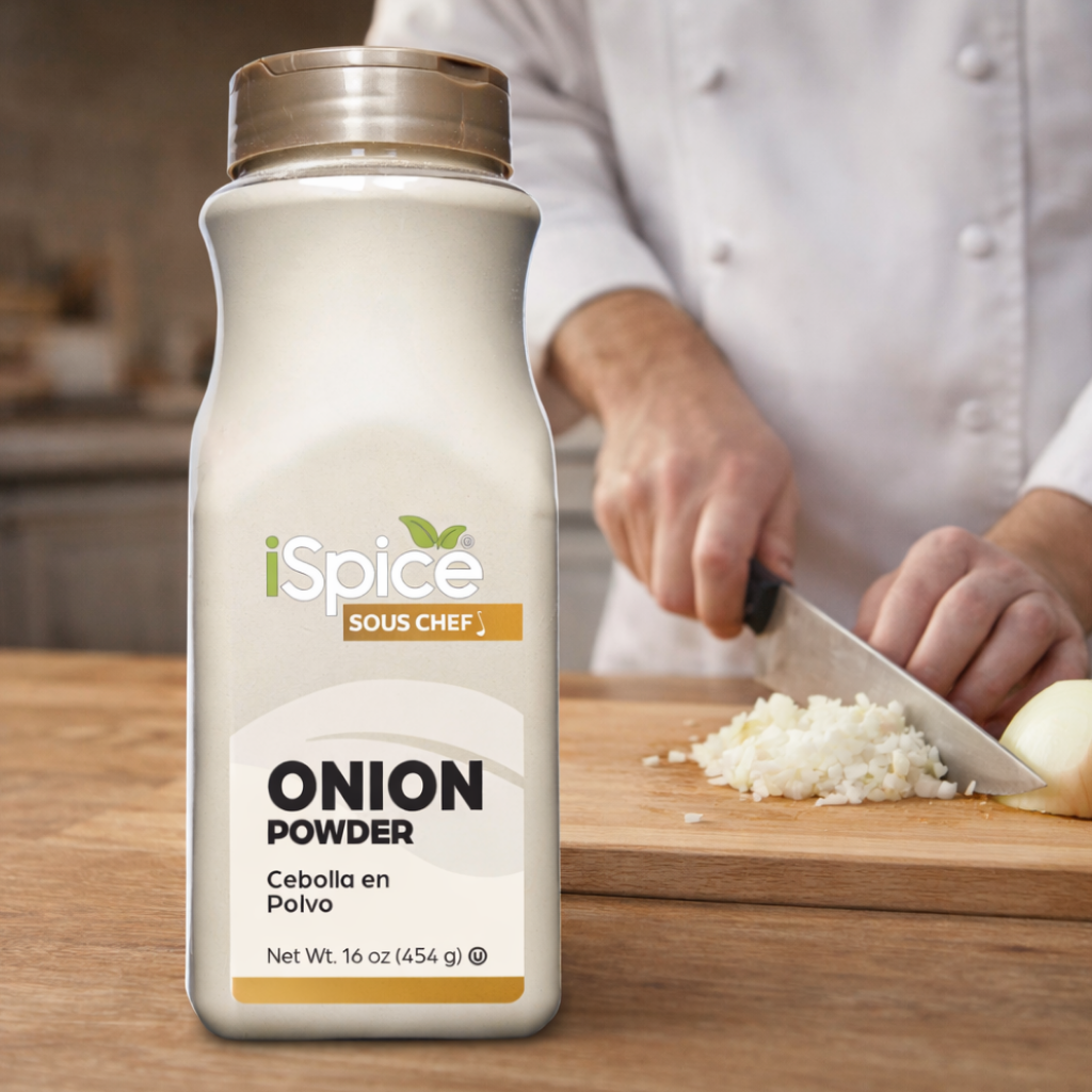 iSpice Sous Chef onion powder bottle on a kitchen counter with a person chopping onions.
