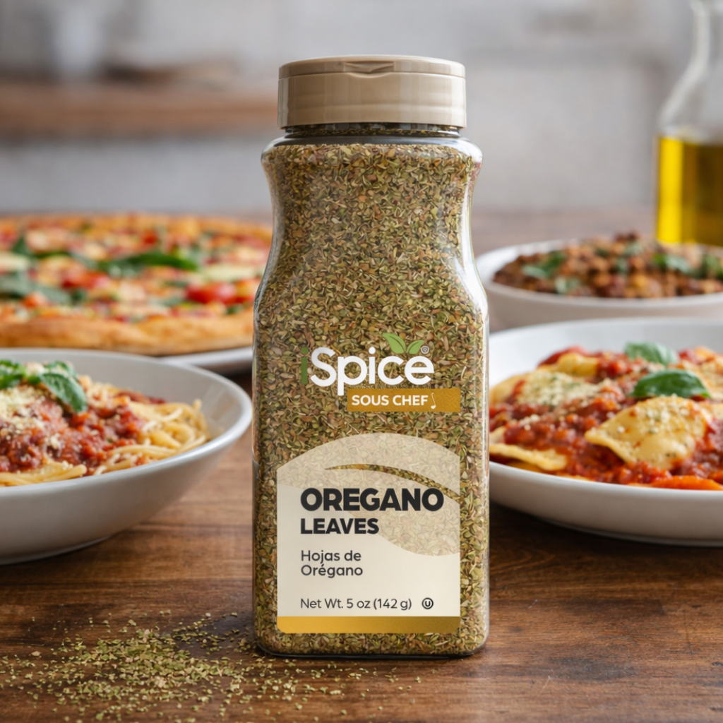 Spice Sous Chef oregano leaves bottle on a wooden table with pasta dishes in the background
