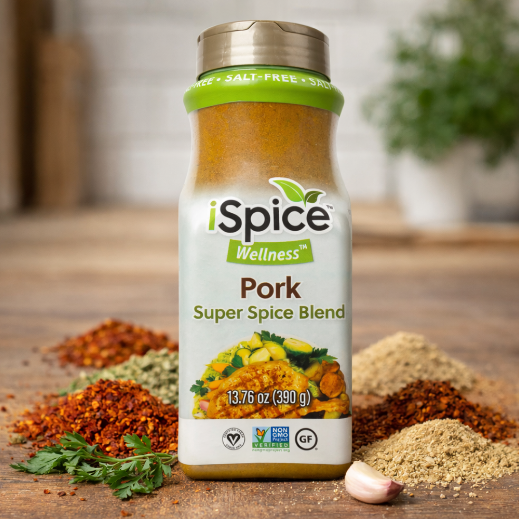 iSpice Wellness Pork Super Spice Blend bottle on a wooden surface with spices around