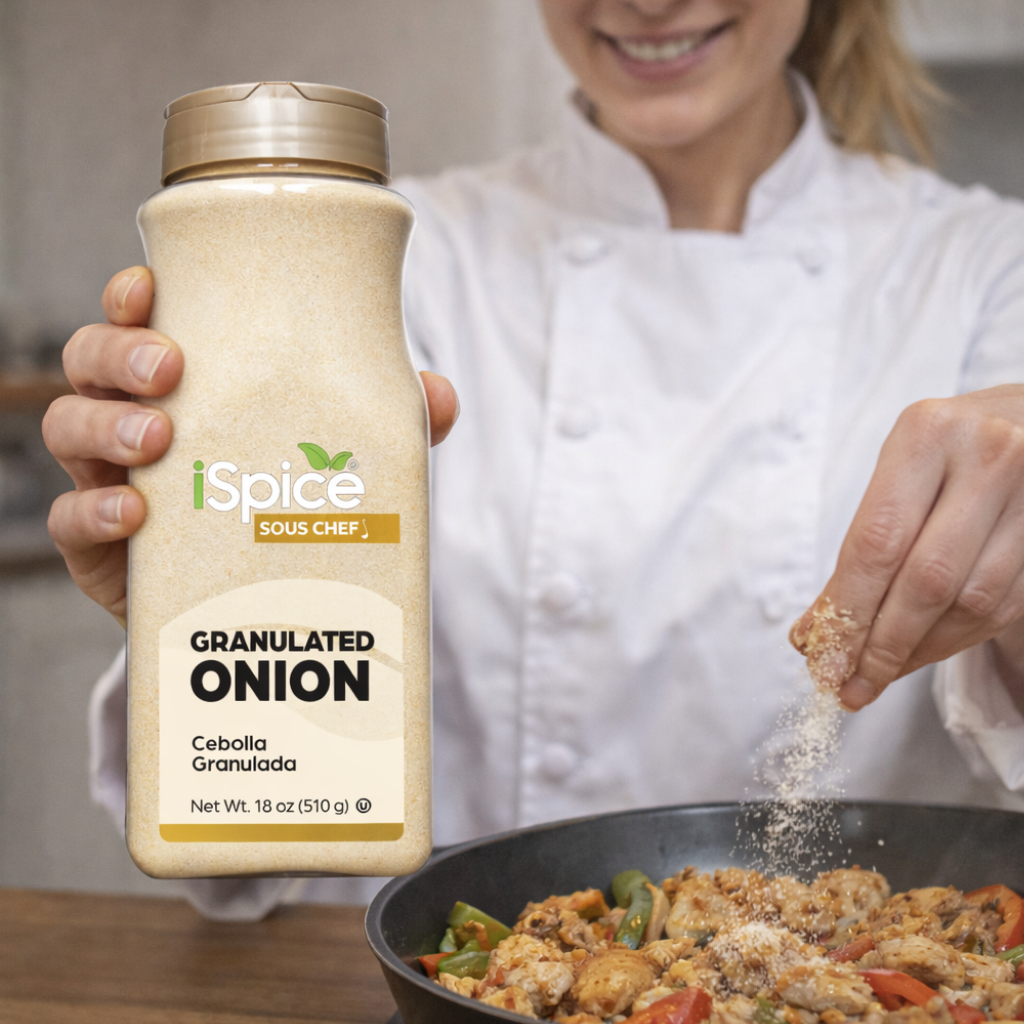 Person sprinkling iSpice granulated onion into a pan of food