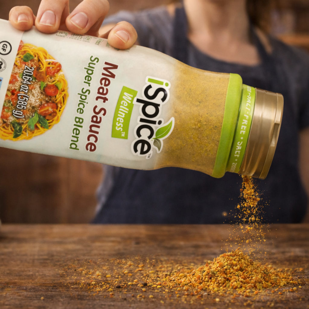 Person pouring iSpice Wellness Super Spice Blend into a container on a wooden surface