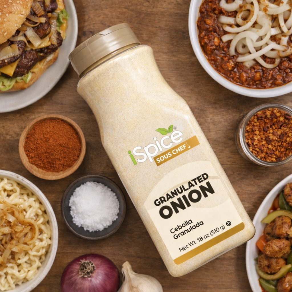 Spice Sous Chef granulated onion bottle on a wooden table with food items.