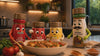 The iSpice jar characters cooking a chicken dish together in a kitchen